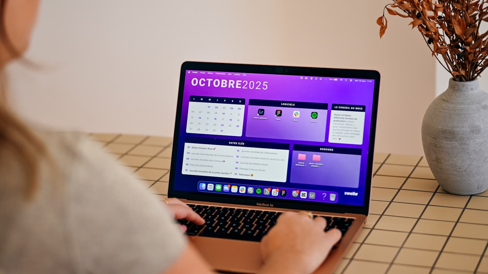 Person at a laptop reviewing a monthly calendar of available meeting slots to schedule a client call