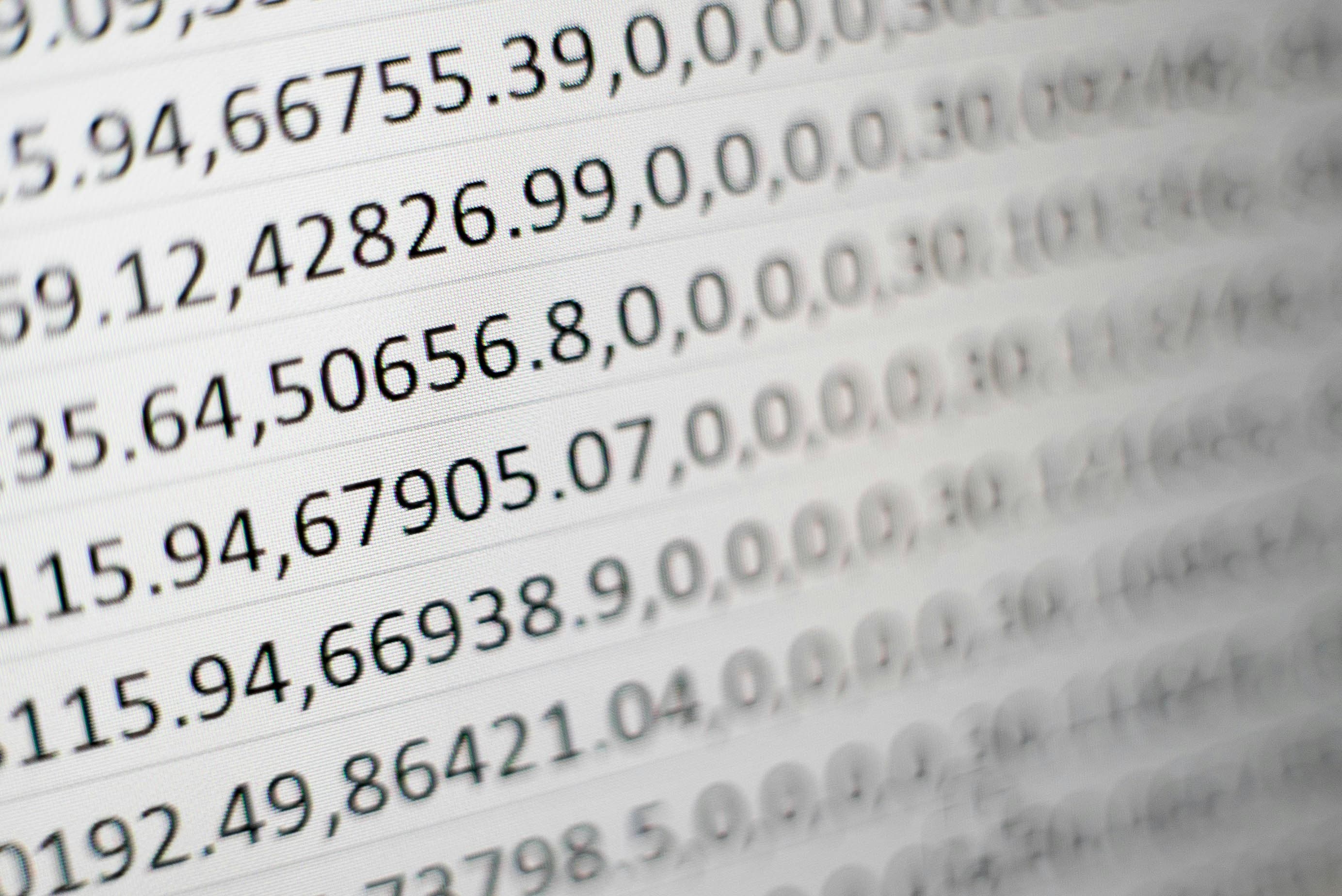 Overwhelming spreadsheet data on screen representing an agency that has outgrown manual tracking